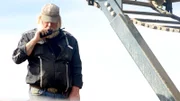 Tony Beets using radio next to wash plant