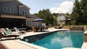 Peek Pools and Spas has completely transformed this backyard into the Biddle Family's dream as seen on Pool Kings. AFTER 3 (exterior, after)