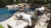 The Riddle Pool ambiance is complete utilizing elegant neutral tones and timeless classic iron structures.