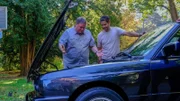 L-R: Mike and Elvis looking at engine