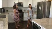 Lynda and Allison look at a kitchen