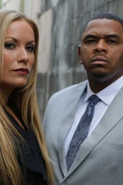 Melissa Lewkowicz and Chris Anderson are in an alley.