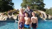 The fleming family standing pool side smiling, as seen on Pool Kings.