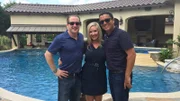 Paul Zars (left), designer Elizabeth Kilgore (center), and Tony Aguasvivas pose together in front of the Hall family's new pool, spa, and covered patio.