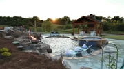 Peek Pools and Spas has completely transformed this backyard into the Paxson Family's dream as seen on Pool Kings. AFTER 3 (exterior, after)