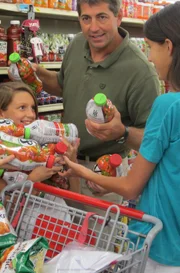 Haley’s dad and sisters pick flavors of tomato juice.