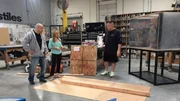 Wayde (r.) and Brett (l.) showing Agnes how to create a template for the enclosures.