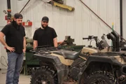 Clint Greathouse and Zachary Prouty discuss the ATV Gold Sluice in the shop.