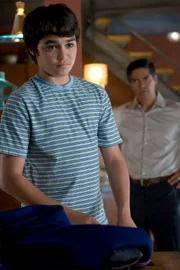 Rebirth" -- Pictured: (l-r) Sina Najafi as William Adama, Esai Morales as Joseph Adama -- Syfy Photo: Eike Schroter