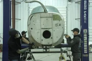 The guys work on the 1958 Beechcraft airplane in the shop.