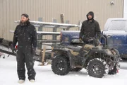 Clint Greathouse and Zachary Prouty take the ATV Gold Sluice outside to test.