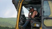 Rick Ness smiling in the excavator.