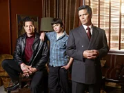 -- Pictured: (l-r) Sasha Roiz as Sam Adam, Sina Najafi as William Adama, Esai Morales as Joseph Adama -- Syfy Photo: Joe Pugliese