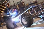 Welding the wagon for the minibike in the shop.