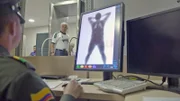 BOGOTA, COLOMBIA- An official controlling the Body Scan.