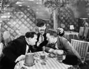 Oliver Hardy, James Finlayson, Stan Laurel.