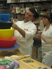 Buffet cake and Coney Island cake. Buddy teaches Christine Campanelli how to apply edible paper transfers to the Coney Island Freak Show cake.