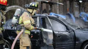 Arson expert Richard Jones leads Chris Anderson through a fiery experiment, with the help of some firemen.