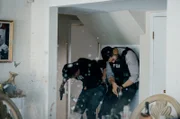 Pictured (L-R)  Special Agent Stuart Scola (John Boyd) and  Special Agent Omar Adom "OA" Zidan (Zeeko Zaki)