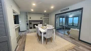 The pre-renovation dining room table at the purchased home, Ridge Rambler. As seen on Magnolia's original series, Beachfront Bargain Hunt Renovation.