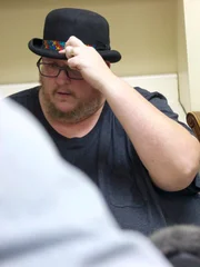 Michael sits in clinic exam room.