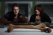 Dan Snow and archaeologist Marge Konsa examining bones of Vikings killed in battle and buried in ship from Salme, Estonia