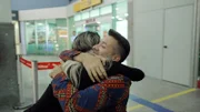 In the airport, Brian Muniz and Ingrid  Rezende Dos Santos hug, meeting for the first time.