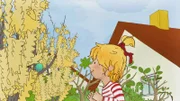 Conni freut sich über den blühenden Osterstrauch direkt im Garten.