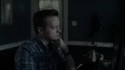 Paranormal Investigator Adam Berry reviewing evidence