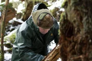 PORT PROTECTION, ALASKA- Sam traps a mink so he can make some more boot grease.  (Photo Credit: National Geographic Channels/Gregory Schmittel)