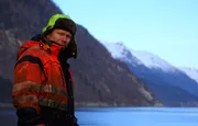 ODDA, NORWAY - Thord with mountain backdrop.