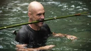 Ed Stafford gathers materials for his bushcraft as he wades through the water in Valley of the Gods, Taiwan