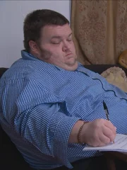 Nathan working from home on couch.
