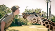 Robert with a giraffe.