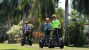 Home buyers Denise Norrisi (R) & Brian Norrisi (L) riding on segways as seen on Hawaii Hunters (action)