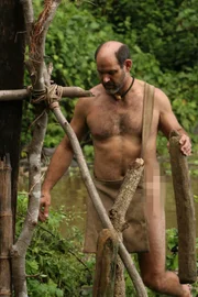 James Lewis finding logs for shelter.