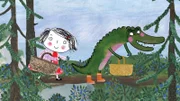 Rita und das Krokodil sammeln Blaubeeren im Wald.