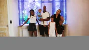 Adrian and his family in front of their new tank.