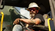 Ryan Hofer sitting in an excavator.