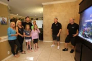 The family is amazed with their new aquairum.