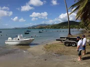 Eric and Roberto Reyes unload their vessel into the water.