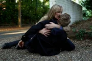 Hannah Laing (Lesley Sharp) holding her son Christian after he was shot (Patrick Gibson)