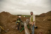 Ryan Hofer and Ben Hudack repairing water line.