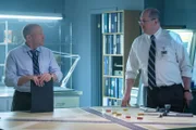 NTSB investigators Bob Benzon (played by Thom Mariott) and Richard Rodriguez (played by Robert B. Kennedy) map out the collision of Northwest Airlines Flights 1482 and 299 on a diorama.