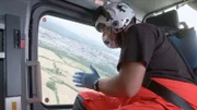 Doctor Tim looking out the helicopter