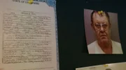 Dokument und das Bild eines Verdächtigen