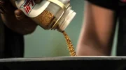 Close up of gold being poured into pan