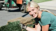 Jasmine smiles because the beautiful sod is here!