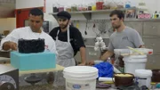 Buddy works on the Moxie Salon cake.