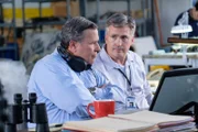 TSB Investigators Mike Cunningham (played by Judah Katz) and Alan Chaulk (played by Glen McDonald) review evidence of what could have downed Cougar Helicopters Flight 91.